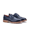 Navy blue leather wingtip derby shoes