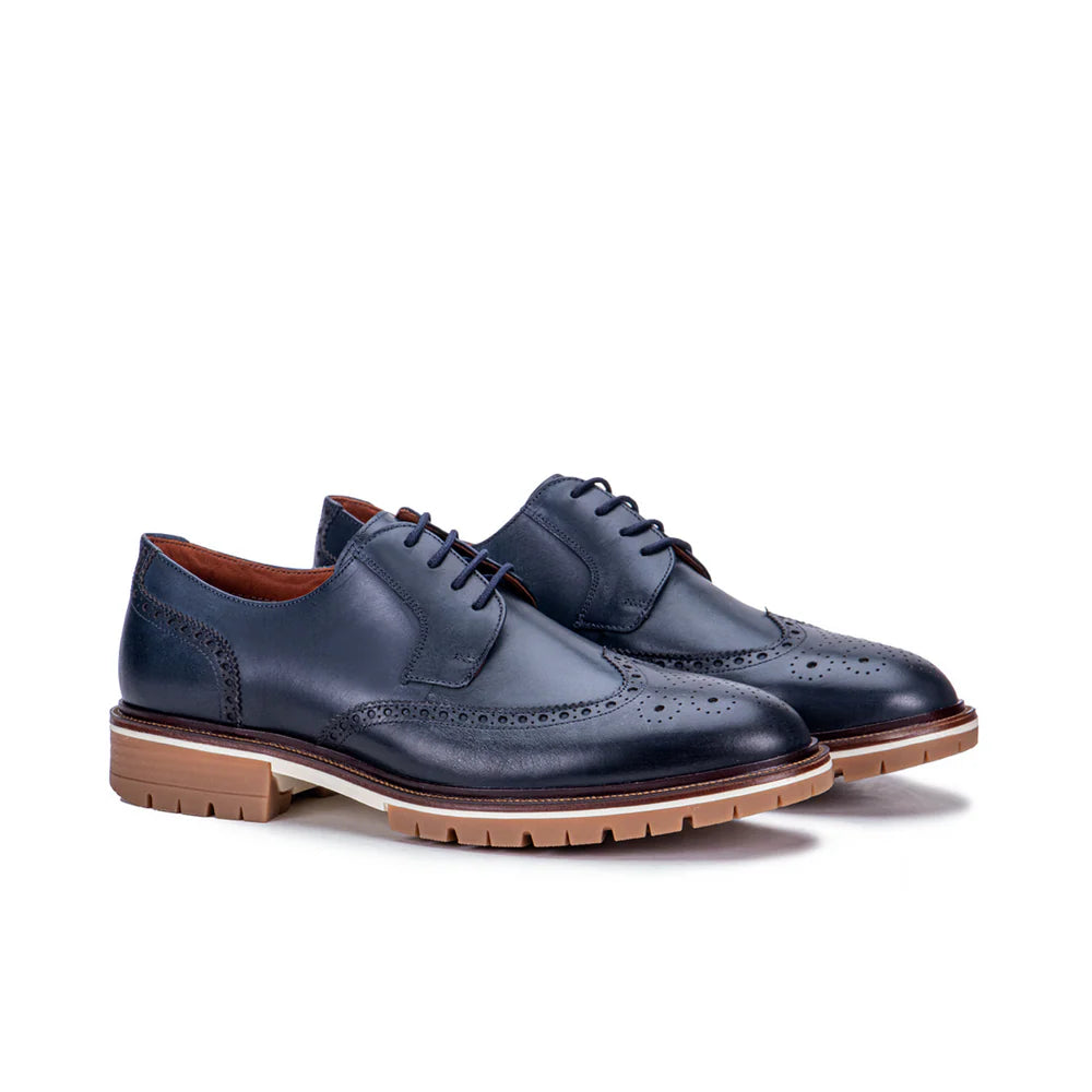 Navy blue leather wingtip derby shoes