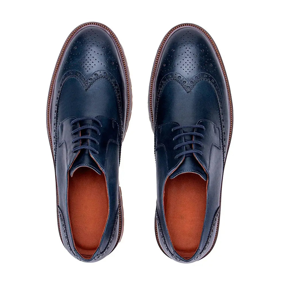 Navy blue leather wingtip derby shoes